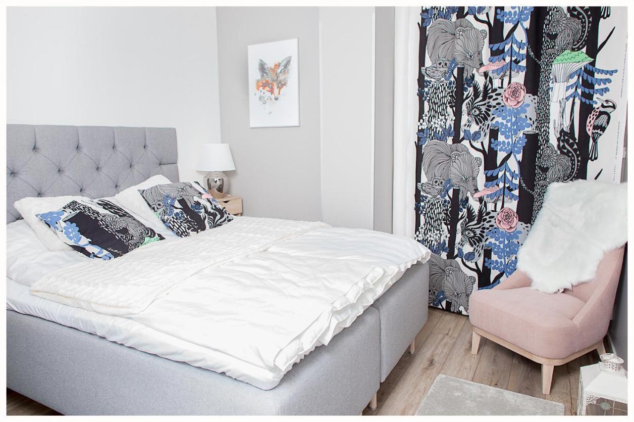 Crystal Arctic Suites Rovaniemi Dış mekan fotoğraf Bedroom with a bed and a chair